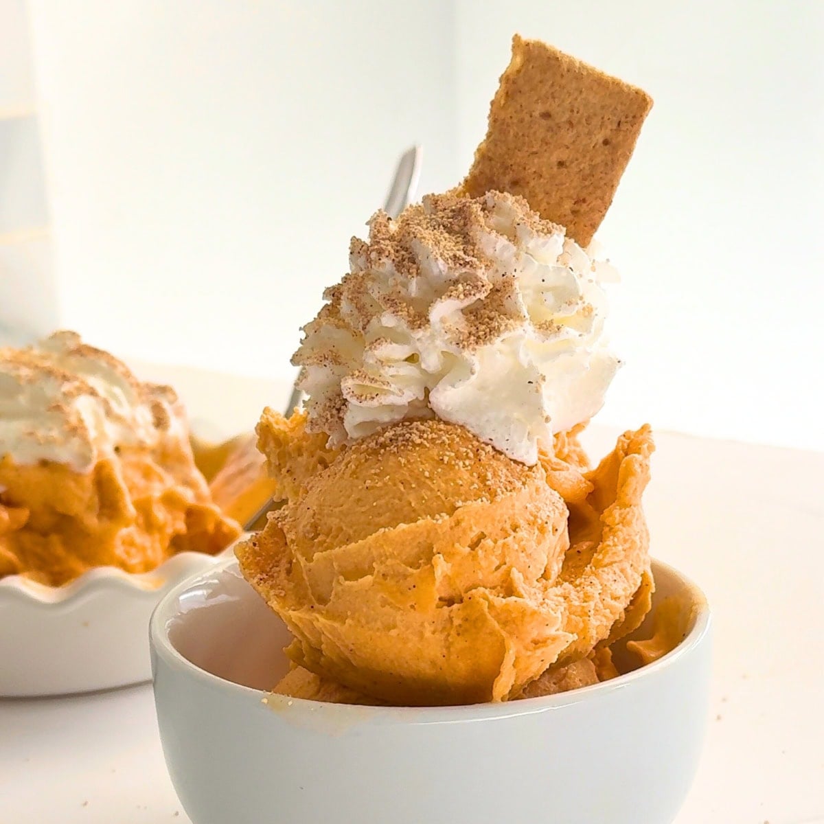 pumpkin protein ice cream with a graham cracker
