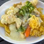 white plate filled with chicken alfredo spaghetti squash