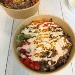 overhead view of cheeseburger bowls in brown bowls