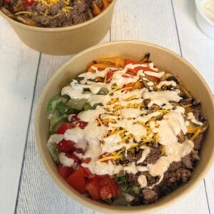 overhead view of cheeseburger bowls in brown bowls