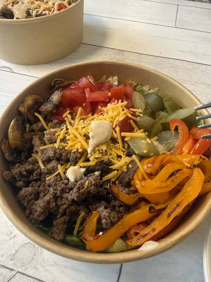 close up of a cheeseburger bowl in a brown bowl